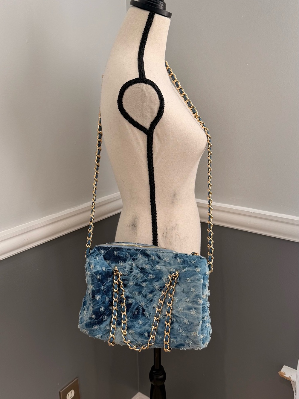 Akira Call Me Paris denim mini duffle bag distressed with gold chain straps.